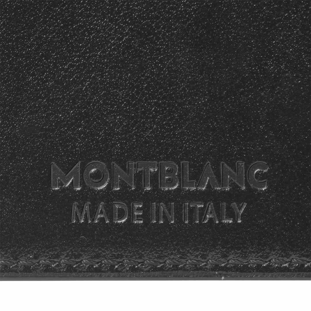 Close-up of the Montblanc Meisterstück 6cc Leather Card Holder in luxurious black leather with the embossed text "MONTBLANC MADE IN ITALY" on its surface.