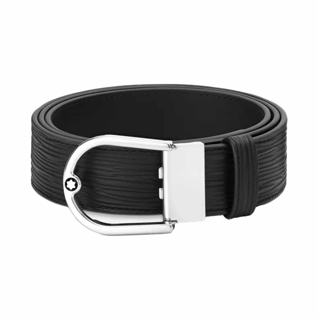 The Montblanc Horseshoe 35mm Reversible Leather Belt, crafted by Montblanc, showcases a textured rolled black leather design with a shiny silver palladium-finish buckle.
