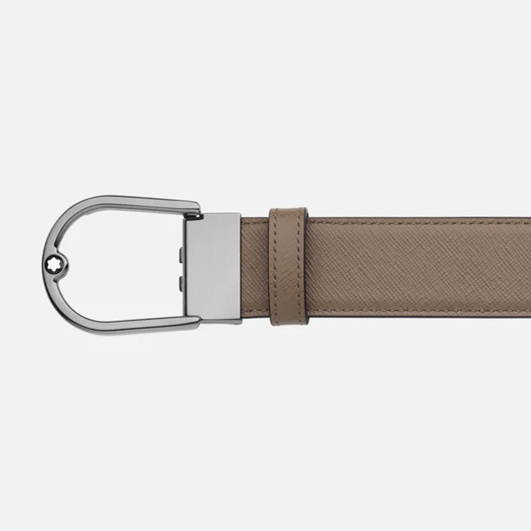 The Montblanc Horseshoe Buckle Saffiano Printed Mastic 35mm Reversible Leather Belt features a silver buckle and rectangular loop, with its tan textured leather adding style against a white background.