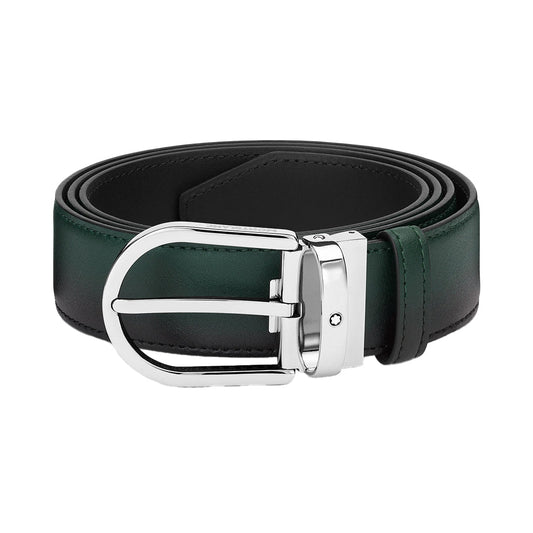 The Montblanc Horseshoe Buckle Sfumato British Green 35mm Leather Belt showcases a stylish design with a sleek palladium horseshoe buckle featuring a subtle logo. It has a smooth, glossy finish that highlights its elegant craftsmanship.