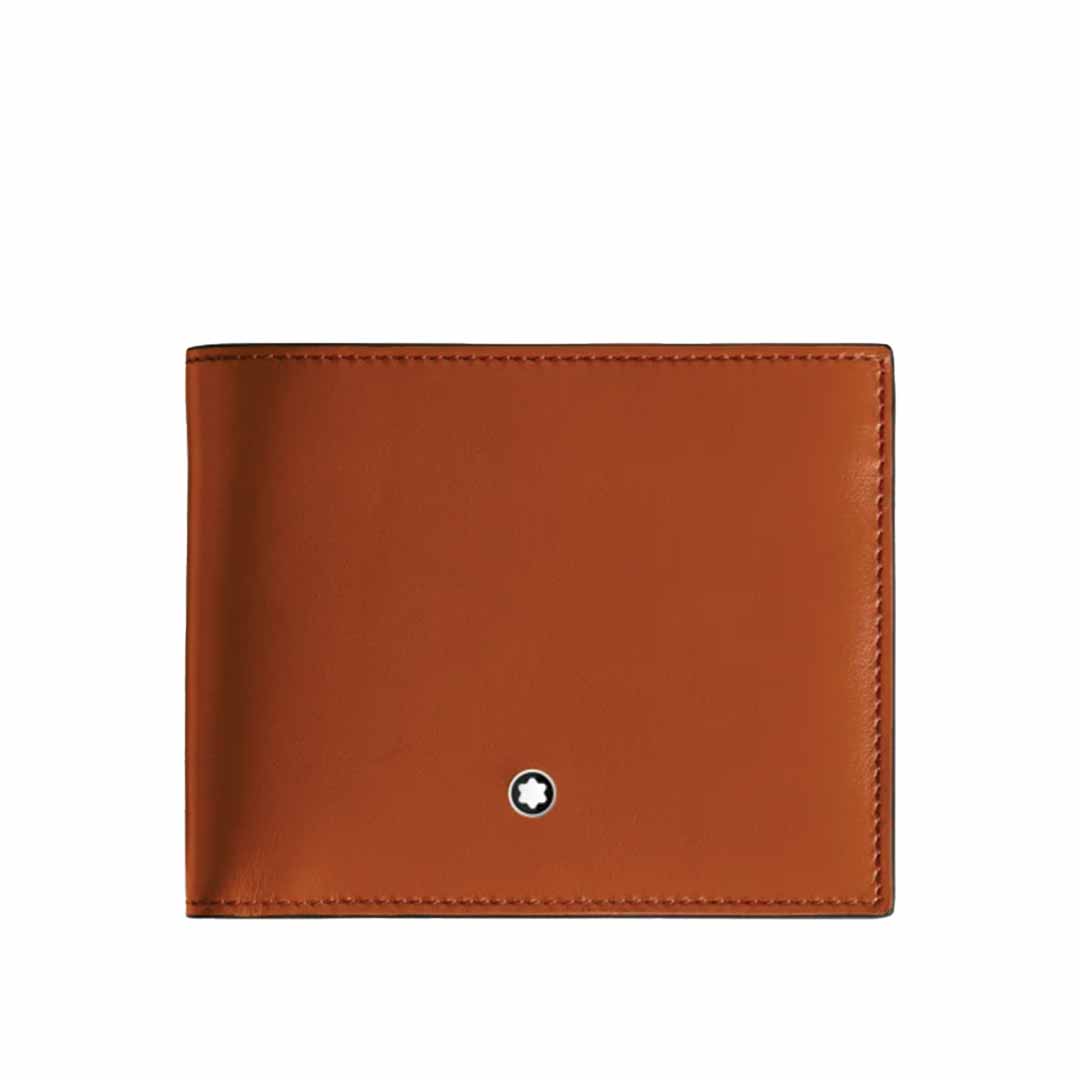 The Montblanc Meisterstück 6cc Leather Wallet, made from rust-colored leather, features a minimalist design highlighted by a small round black and white emblem on the front. It boasts clean stitching and a smooth finish, providing elegant storage for up to six credit cards.