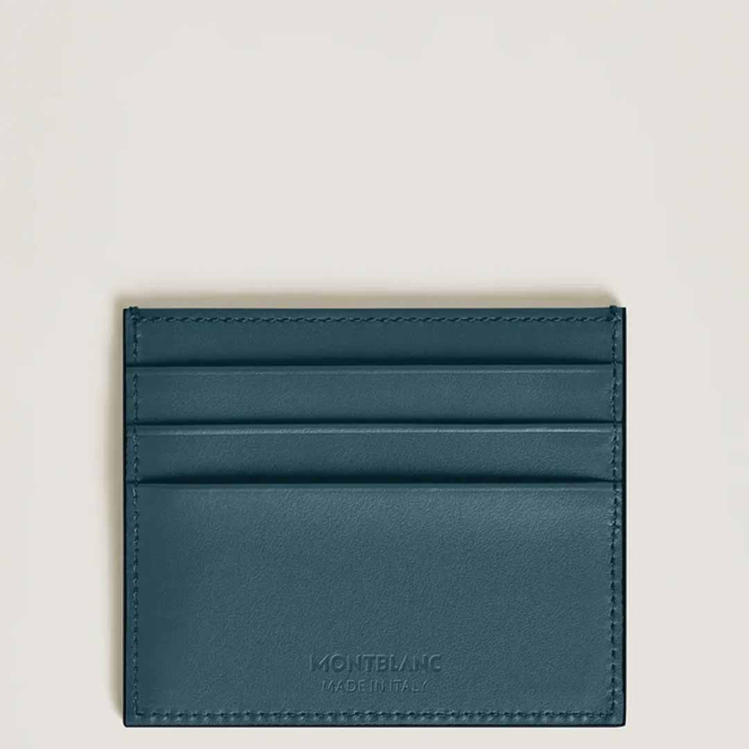 A Montblanc Extreme 3.0 6cc Leather Card Holder in dark teal, featuring three card slots and an embossed logo at the bottom, set against a light background.