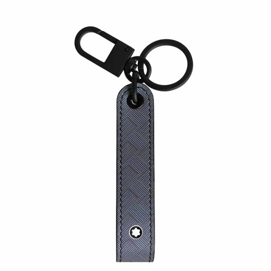 Introducing the Montblanc Extreme 3.0 Black Key FOB, a sleek and fashionable accessory from Montblanc. It showcases a black clip and circular ring, complemented by a textured full-grain bovine leather strap adorned with a subtle geometric pattern and finished with an elegant star-like emblem at the bottom—perfect for elevating your daily essentials.