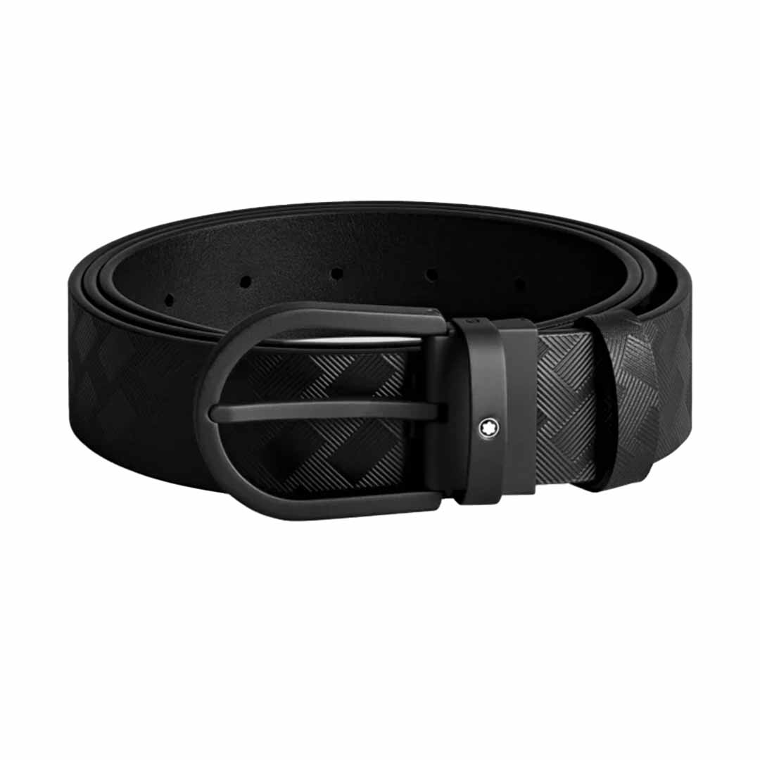 The Montblanc Horseshoe 35mm Leather Belt, crafted from black leather, features a round black buckle and a subtle checkered pattern. For enhanced versatility, it includes multiple adjustable holes. The iconic Montblanc emblem adds an elegant touch to this sophisticated accessory.