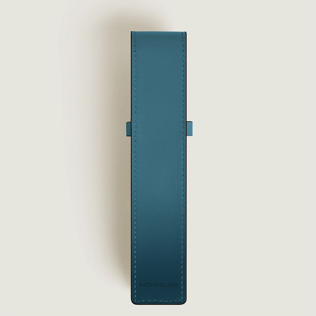 The Montblanc Meisterstuck Leather Pen Pouch in blue calfskin stands upright against a light background, featuring visible edge stitching and the Montblanc logo embossed near the bottom.