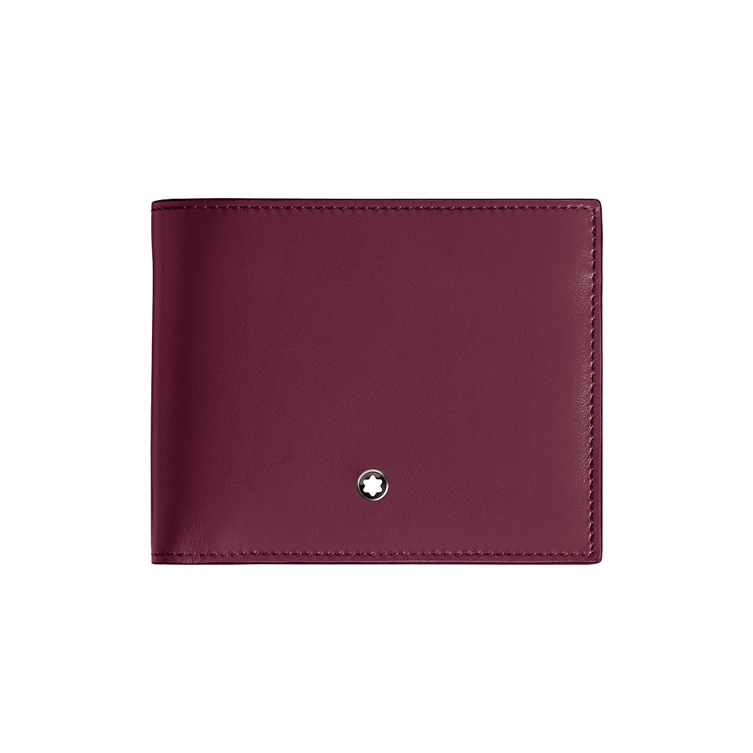 The Montblanc Meisterstuck 6CC Wallet, crafted in sleek burgundy cassis leather, features a minimalist bi-fold design with a smooth texture. A round Montblanc emblem adorns the bottom center, highlighted elegantly against a clean white background.