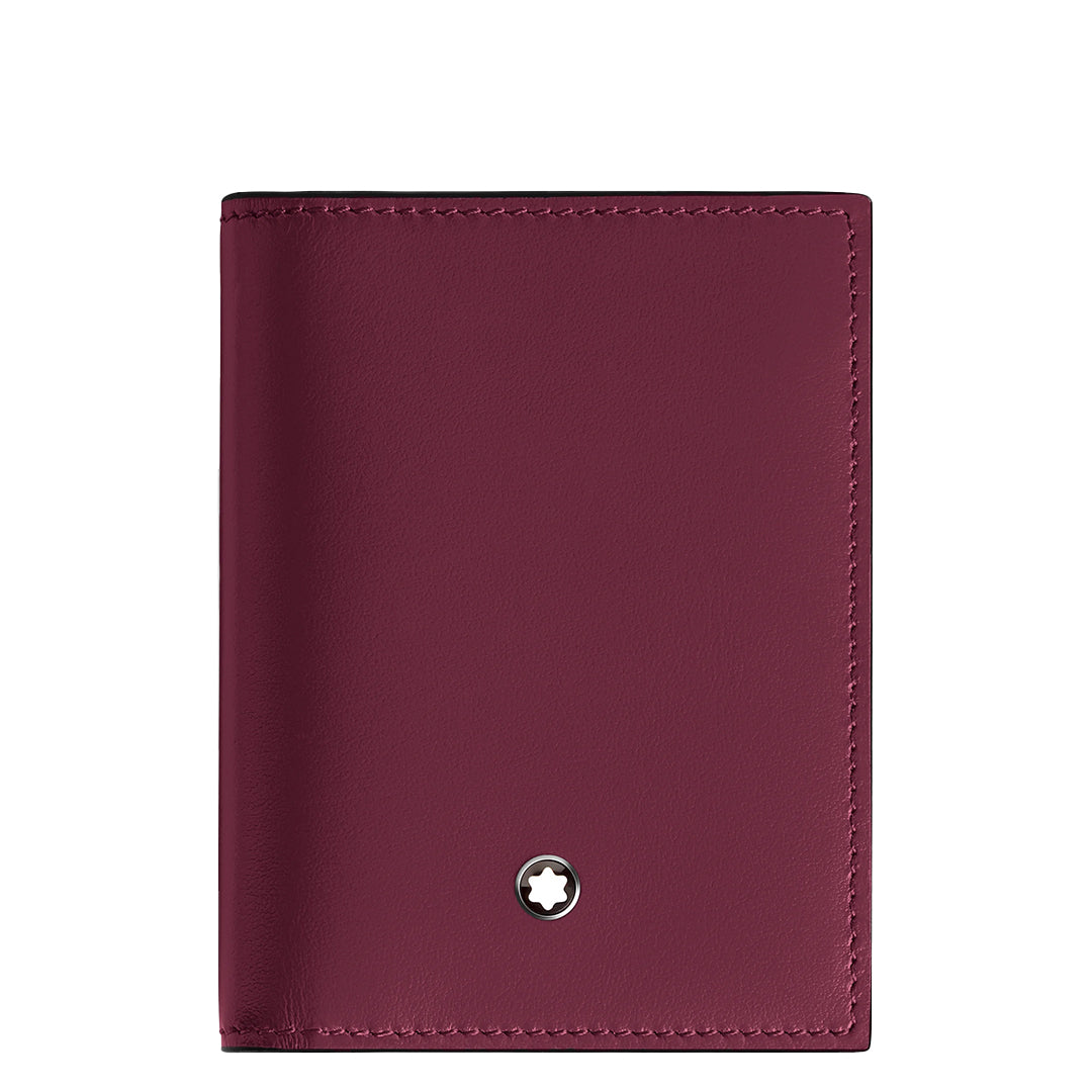 The Montblanc Meisterstuck 4CC Card Holder features cassis leather with a small circular Montblanc star emblem near the bottom, smooth texture, and visible edge stitching for a minimalist and elegant design.