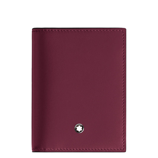 The Montblanc Meisterstuck 4CC Card Holder features cassis leather with a small circular Montblanc star emblem near the bottom, smooth texture, and visible edge stitching for a minimalist and elegant design.