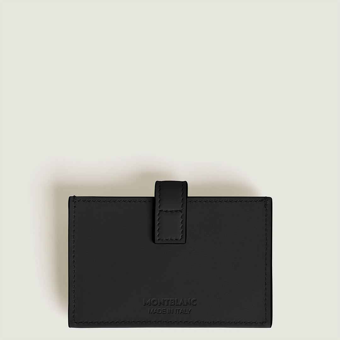 The Montblanc Meisterstuck 5CC Card Holder in black is elegantly showcased against a light gray background, featuring the iconic Montblanc name embossed at the bottom.