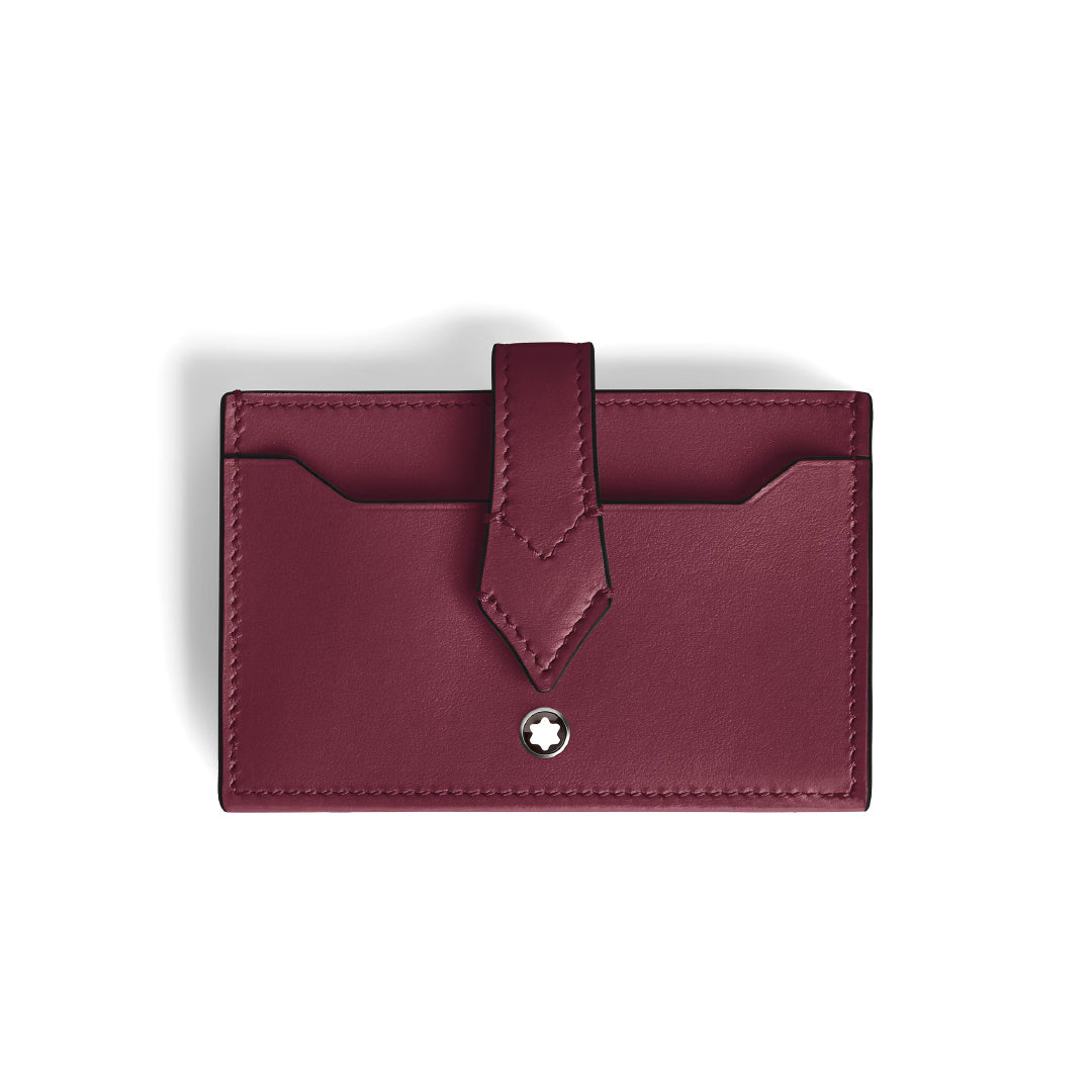 The Montblanc Meisterstuck 5CC Card Holder is a sleek cassis leather cardholder featuring a flap closure and a small circular Montblanc logo. Fine stitching complements its stylish design, with two visible card slots.