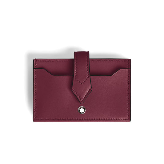 The Montblanc Meisterstuck 5CC Card Holder is a sleek cassis leather cardholder featuring a flap closure and a small circular Montblanc logo. Fine stitching complements its stylish design, with two visible card slots.
