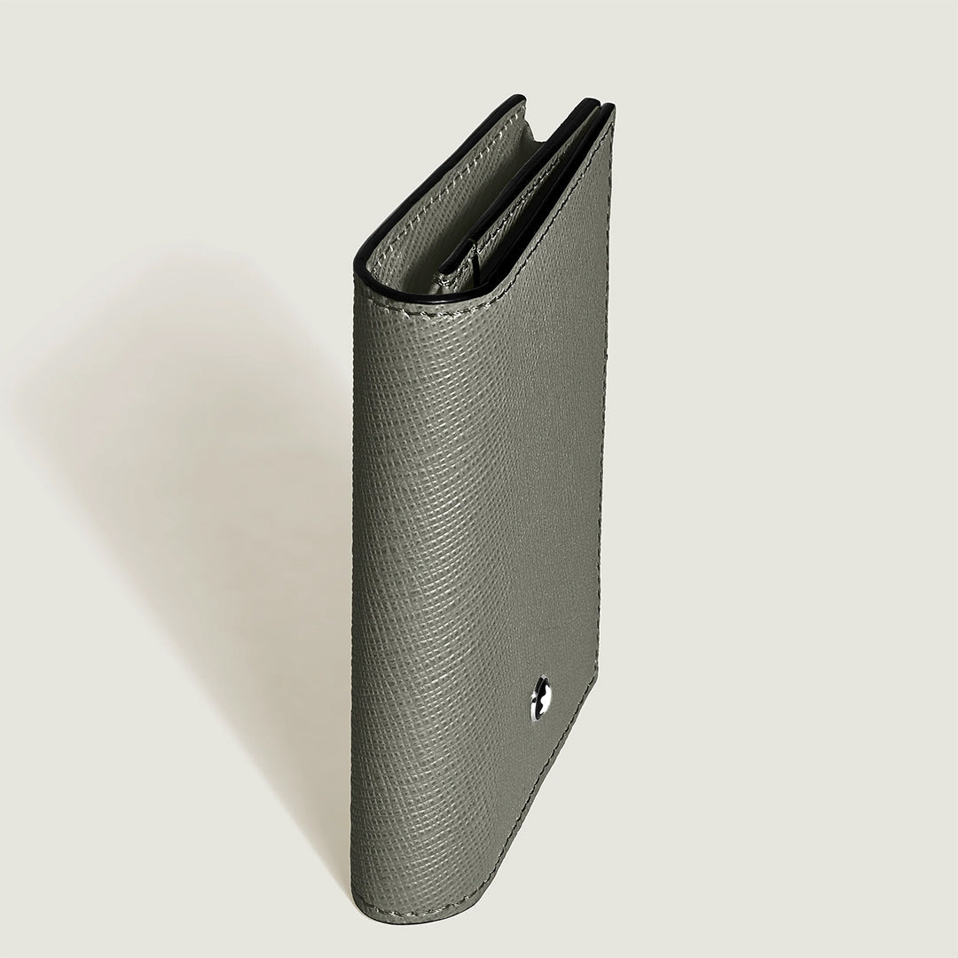 The Montblanc Satorial 4CC Leather Card Holder by Montblanc stands upright on a light background, showcasing its grey Saffiano-printed leather, multiple card slots, and a metallic emblem on the front.