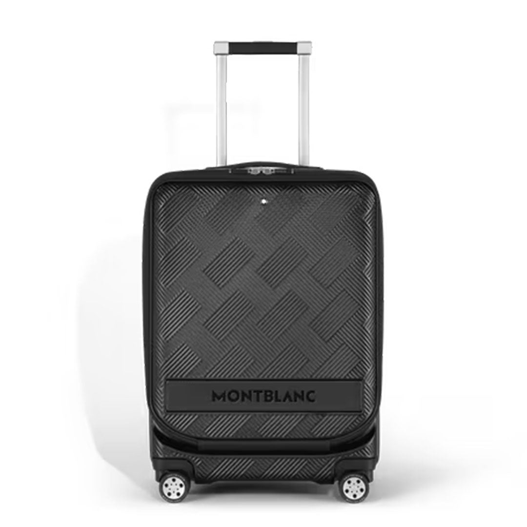 The Montblanc Extreme 3.0 Cabin with Pocket is a black hard-shell polycarbonate trolley bag featuring a geometric texture, four spinner wheels, a telescopic handle, and TSA lock, displayed against a plain white background.