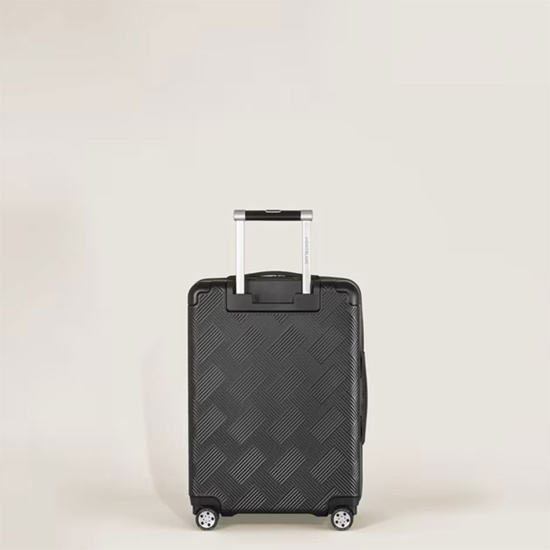 The Montblanc Extreme 3.0 Cabin with Pocket, a small black polycarbonate trolley with a checkered texture, four wheels, and an extended telescopic handle, is shown against a plain light background.