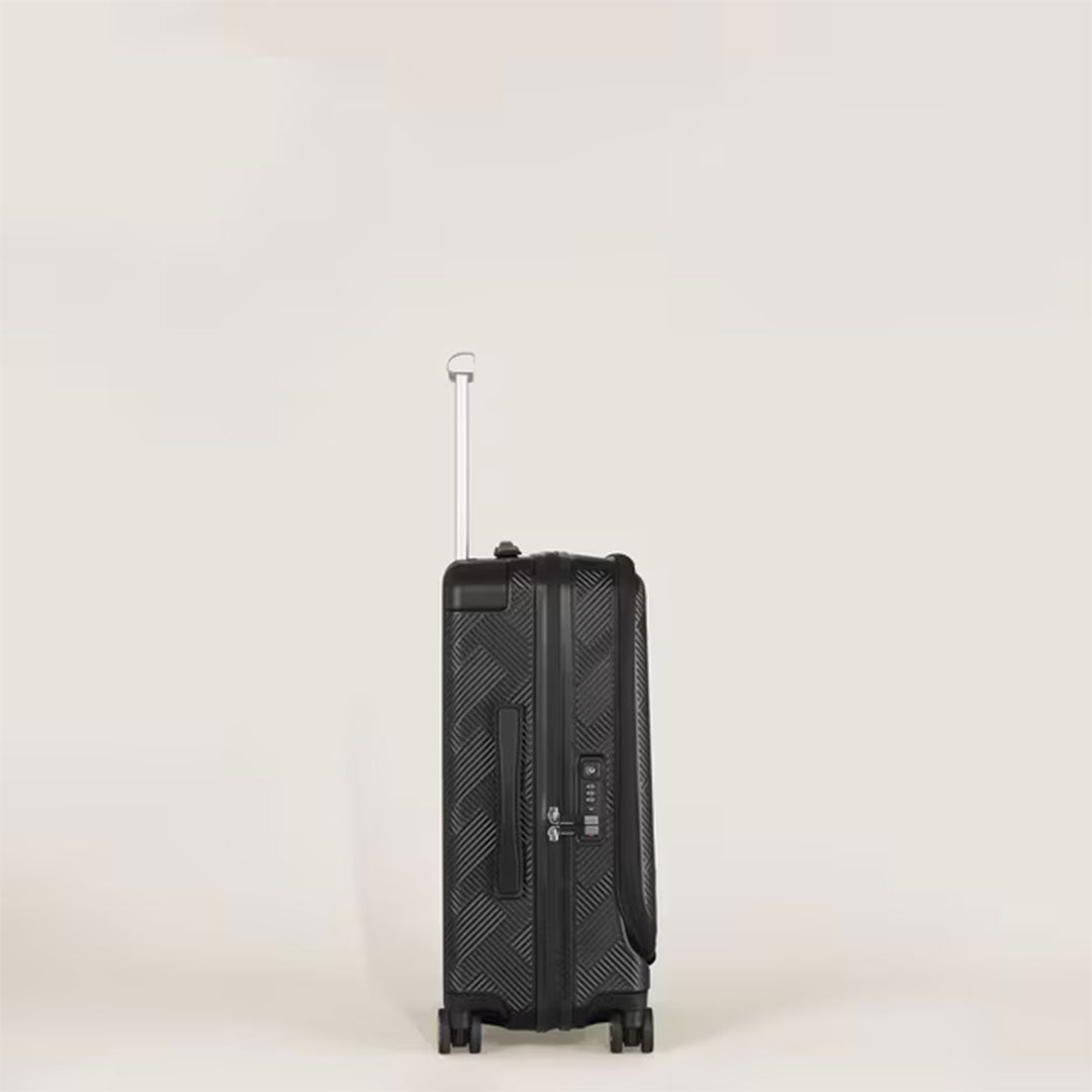 The Montblanc Extreme 3.0 Cabin with Pocket is a black polycarbonate trolley bag with a textured pattern, four wheels, silver telescopic handle, and TSA lock, standing against a plain light background.