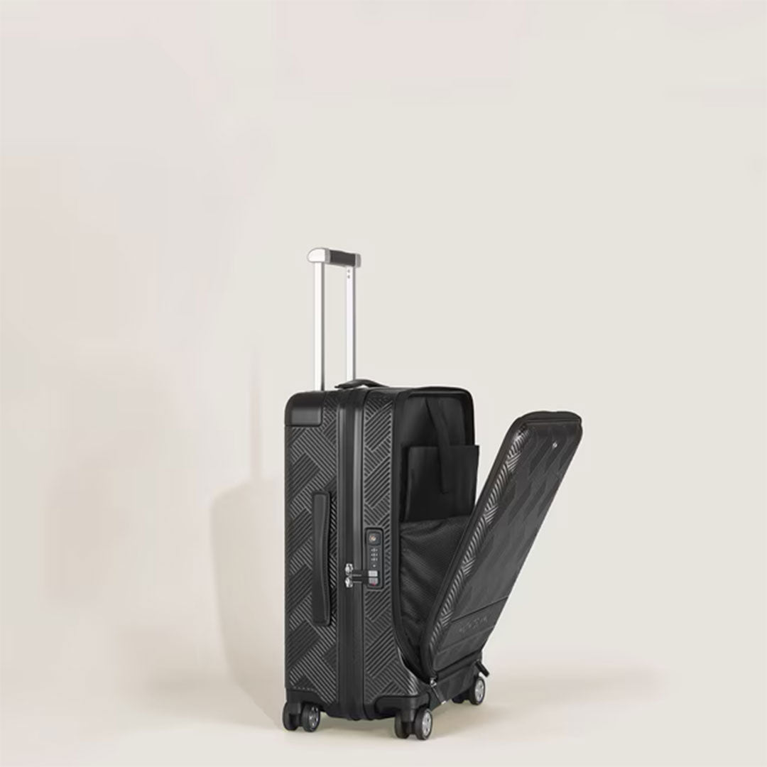 The Montblanc Extreme 3.0 Cabin with Pocket by Montblanc is a black polycarbonate trolley bag featuring a geometric pattern, four wheels, an extended handle, and an open front compartment showing interior pockets against a beige background.