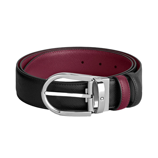The Montblanc Horseshoe Buckle 35mm Reversible Leather Belt features black calf-skin leather, a silver buckle, red inner lining, textured details, and two red loops—offering both style and versatility.