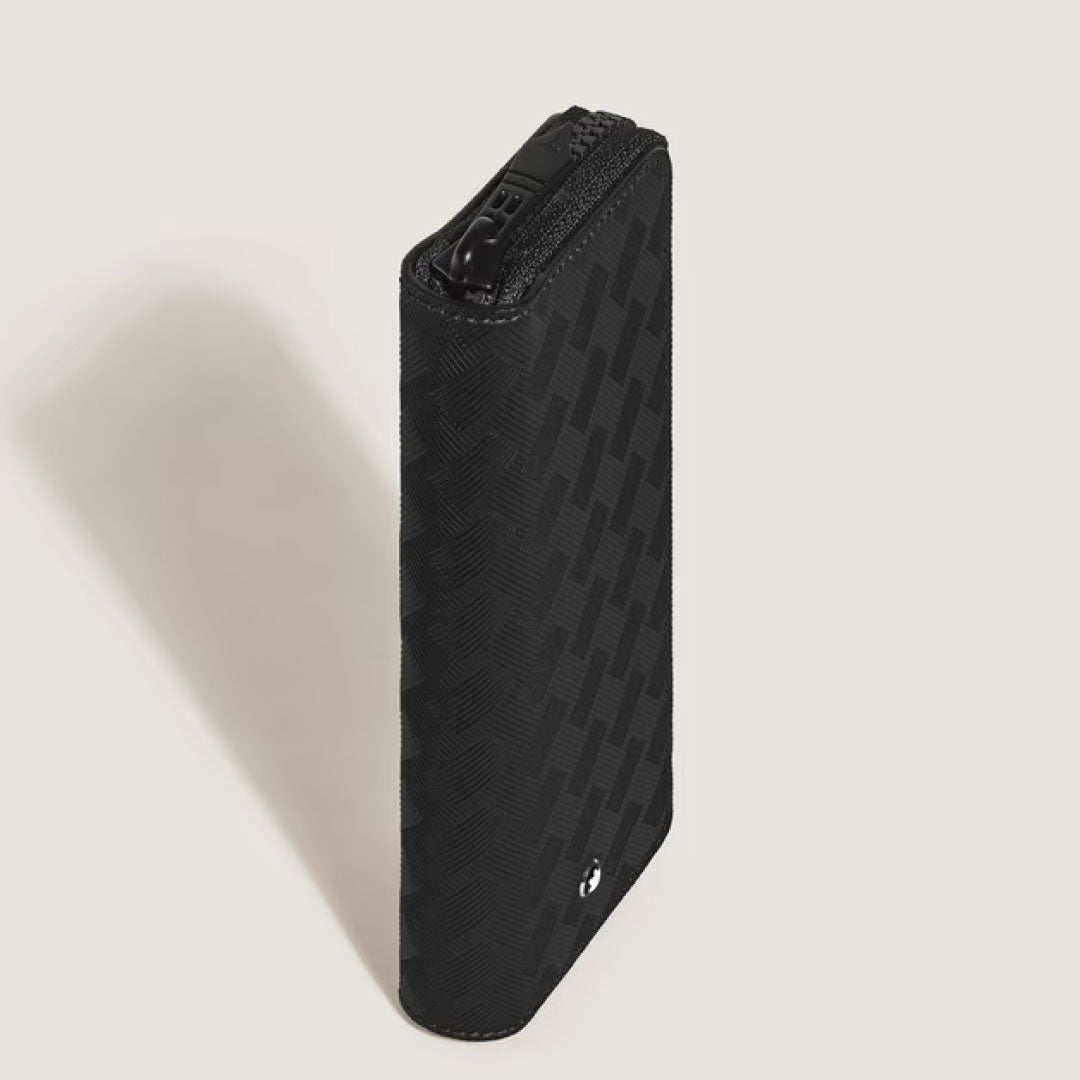 A slim, black Montblanc Extreme 3.0 leather double pen pouch stands upright on a light background, its subtle geometric texture and small logo evoking refined elegance similar to Montblanc’s signature style.