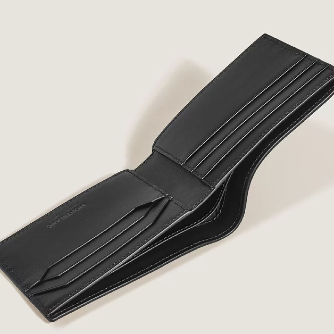 The Montblanc Extreme 3.0 6CC Leather Wallet, shown open on a light background, reveals multiple card slots and compartments—blending elegance with practicality.