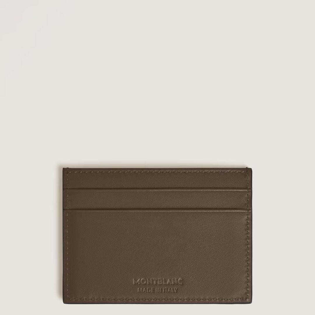 The Montblanc Extreme 3.0 5cc Leather Card Holder in noisette leather features two card slots on each side, the brand’s embossed logo at the bottom center, and is shown against a plain light background.