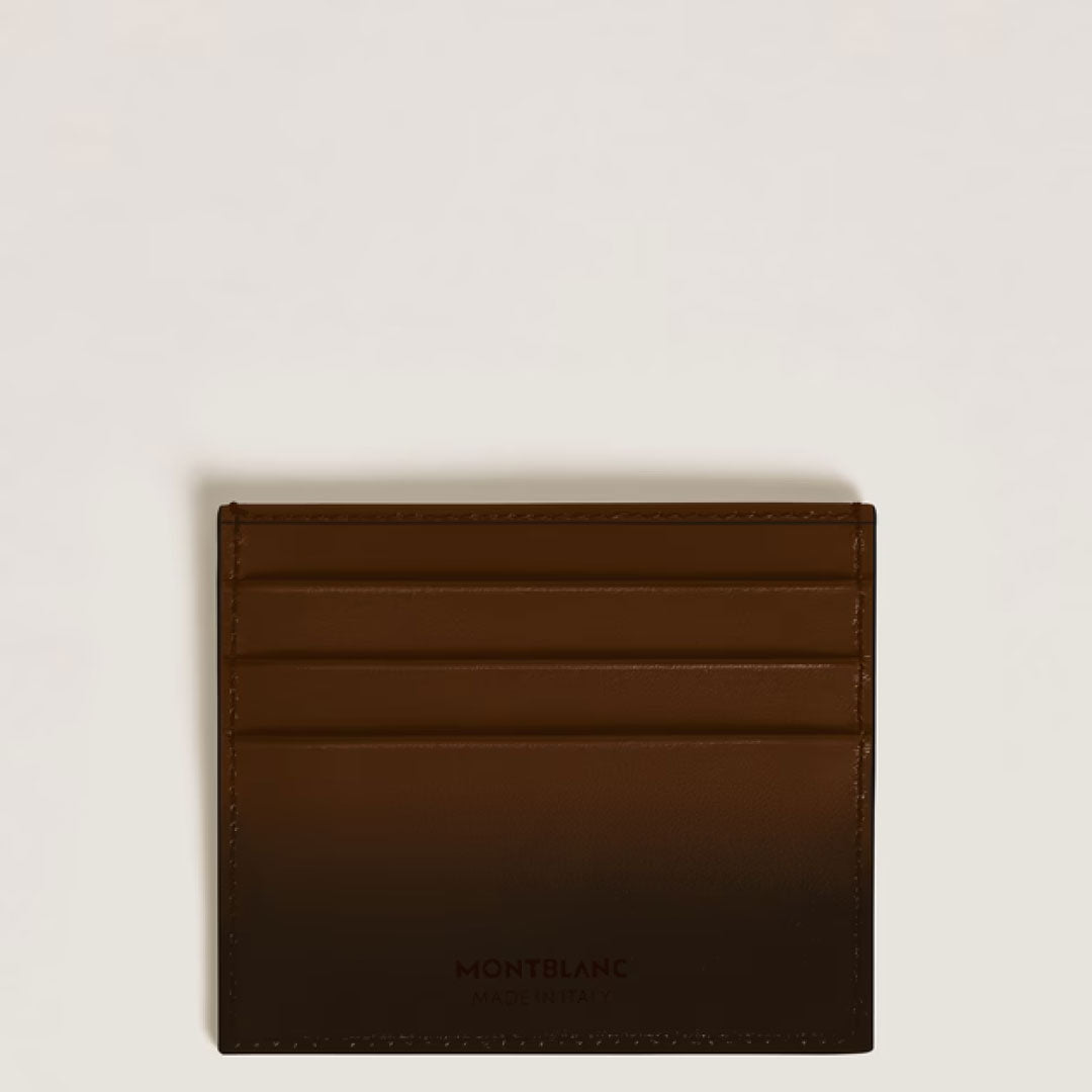 A Montblanc Meisterstuck 6CC Leather Card Holder by Montblanc, shown in brown leather with three card slots, is displayed against a plain light background.