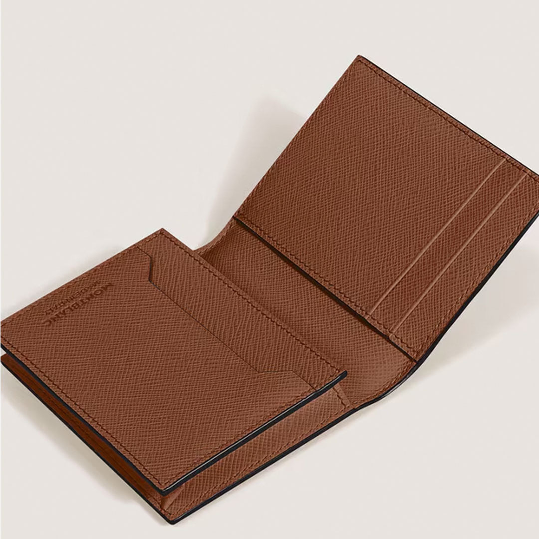 The Montblanc Satorial 4CC Leather Card Holder by Montblanc features textured brown leather, multiple credit card slots, a larger pocket, and neat stitching. Its minimalist design is both elegant and functional.