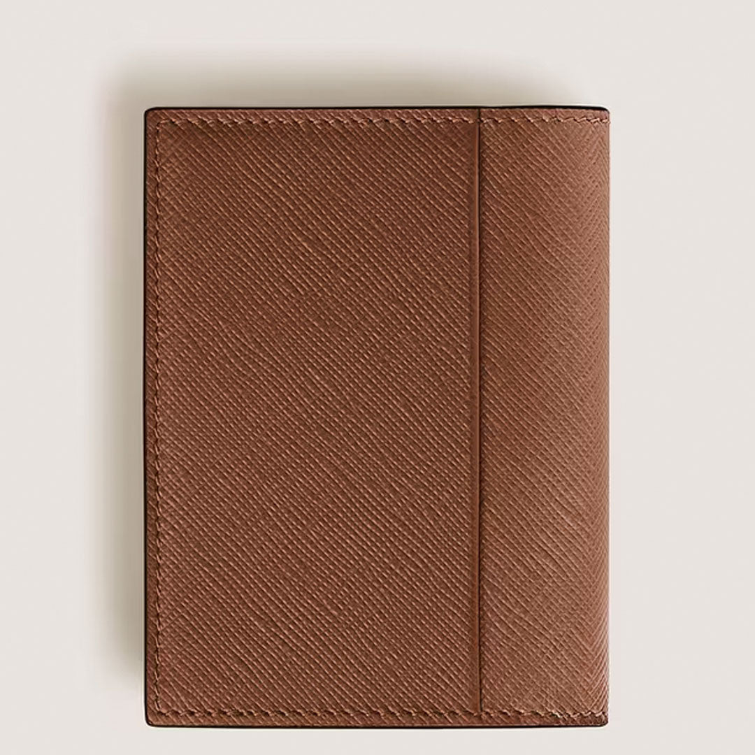 The Montblanc Sartorial 4CC Leather Card Holder, a brown textured wallet with multiple card slots, stands upright against a plain light background.