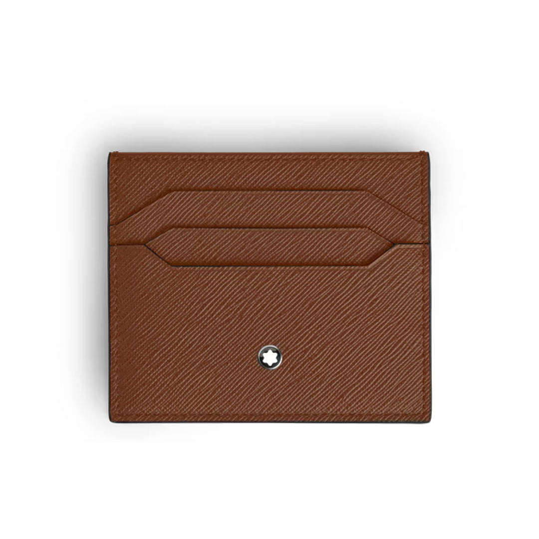 The Montblanc Sartorial Leather 6cc Card Holder, crafted from brown leather with a subtle diagonal texture, features two card slots and a small circular silver emblem near the bottom center, set against a plain white background.