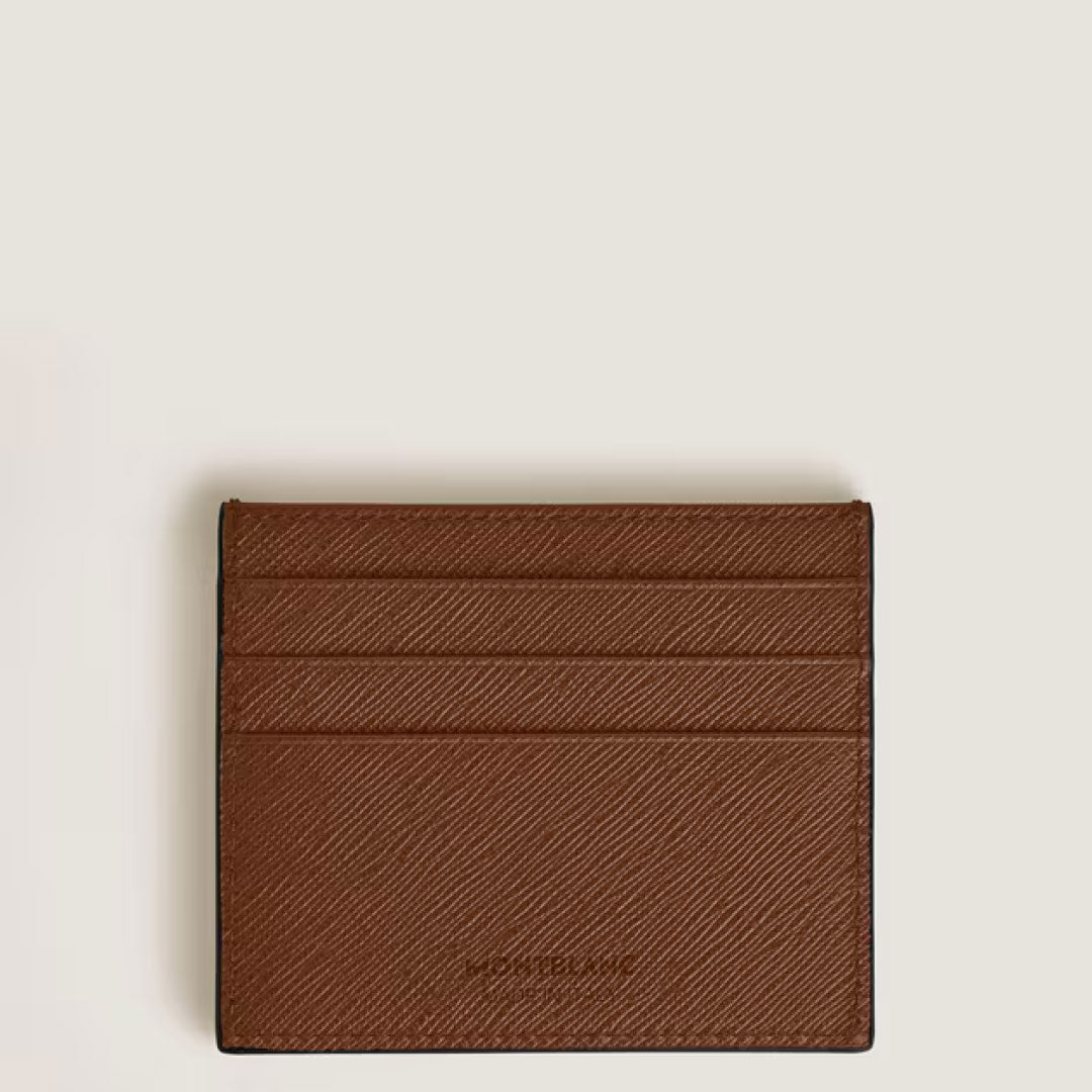 The Montblanc Sartorial Leather 6cc Card Holder features rich brown textured leather and six card slots, set against a plain light background. This elegant accessory by Montblanc keeps your essentials organized in style.
