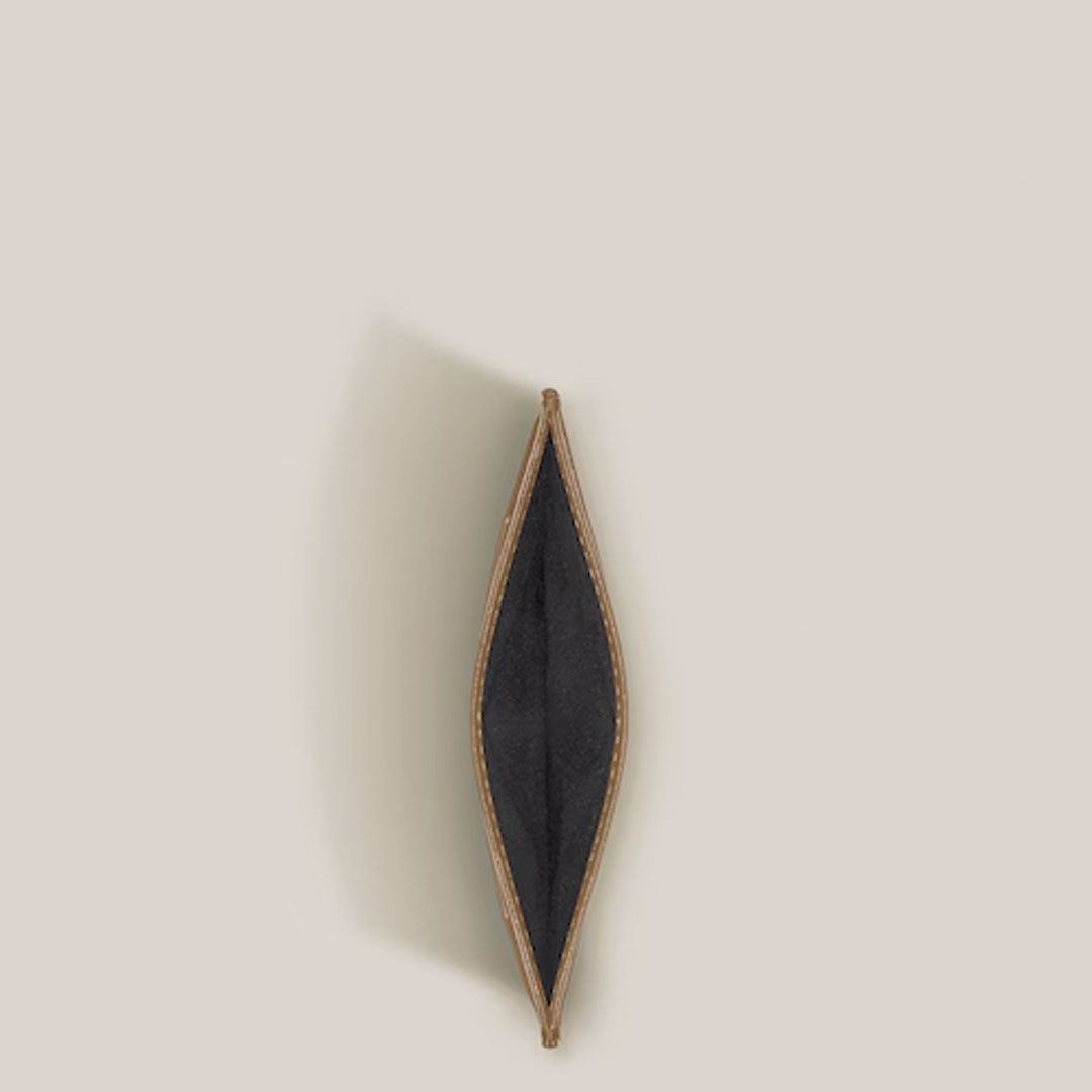 A top-down view of an open, empty Montblanc Meisterstuck 6CC Leather Card Holder in brown calfskin with a dark interior, displayed against a plain light beige background.