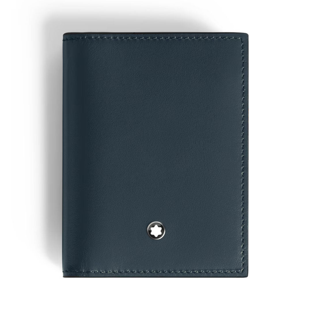 The Montblanc Meisterstuck 4CC Leather Card Holder is a sleek, dark blue calfskin card holder with precise stitching and a small round silver Montblanc emblem, photographed against a plain white background.