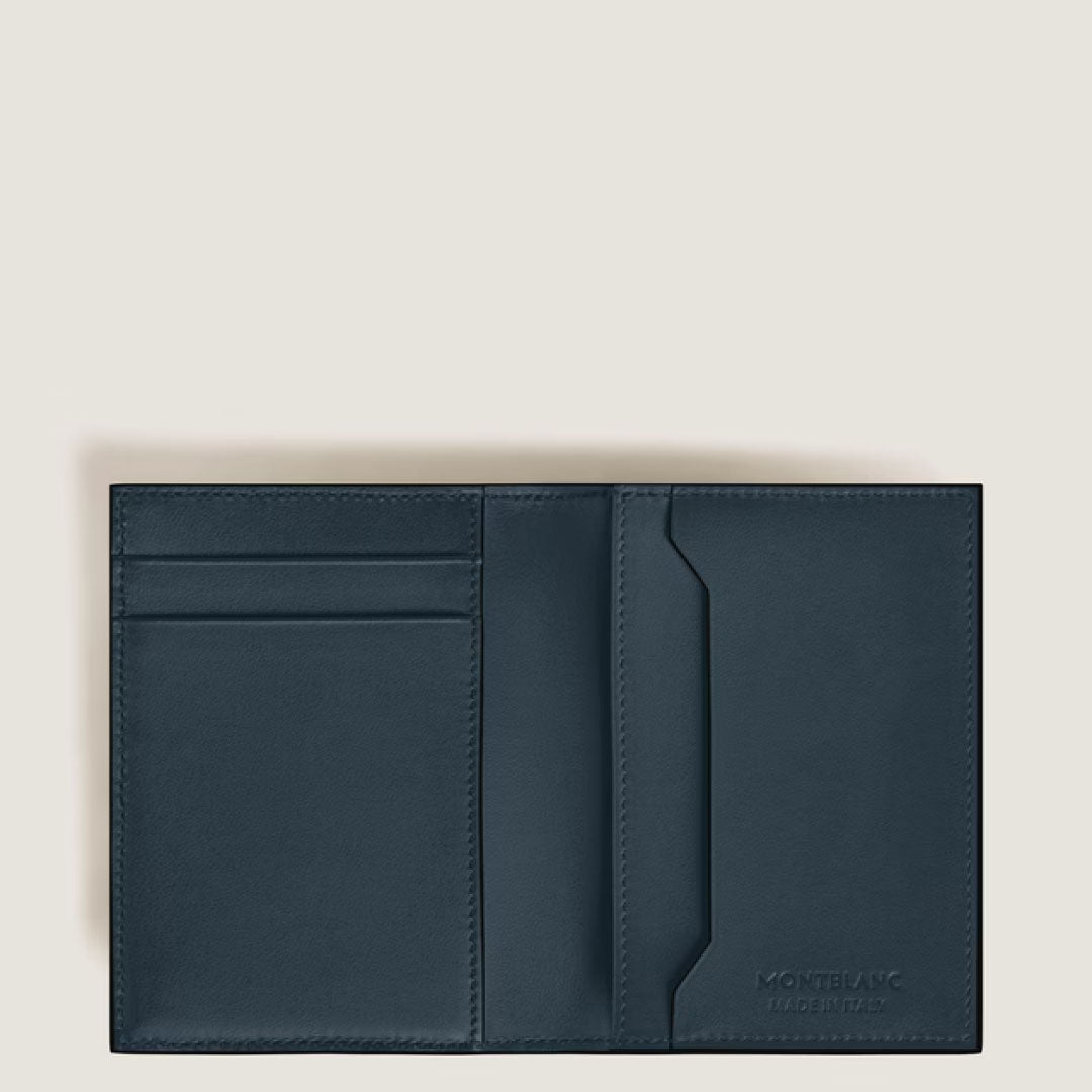 The Montblanc Meisterstuck 4CC Leather Card Holder in dark blue calfskin features multiple card slots and a pocket. Compact and elegant, it displays the Montblanc logo embossed at the bottom right on a light, neutral background.