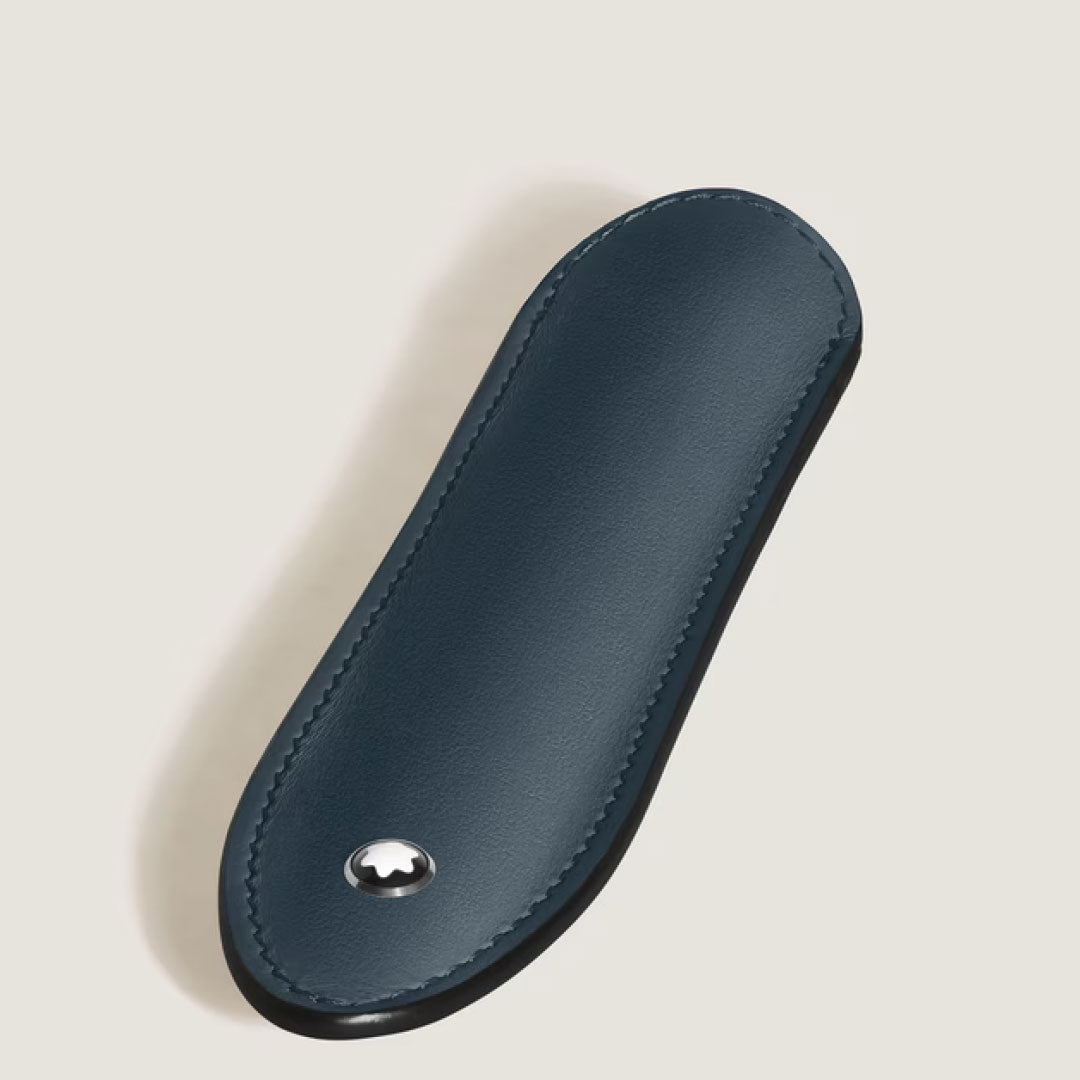 The Montblanc Meisterstück Velvet Blue Single Leather Pen Sleeve is oval-shaped with neat edge stitching and features a metallic Montblanc emblem, shown on a light background.