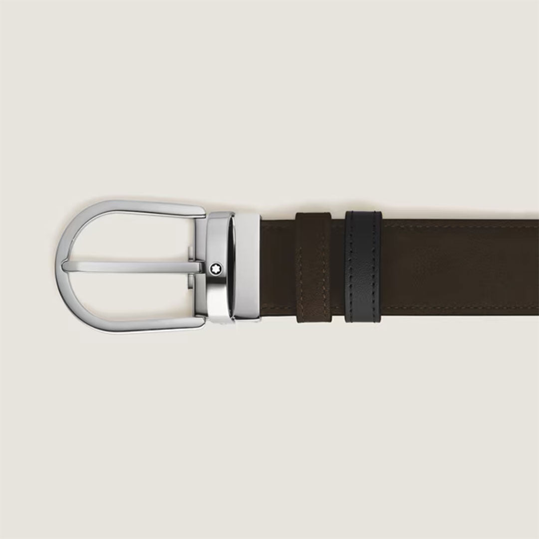 A close-up of the Montblanc Horseshoe Buckle Brown and Black 35mm Reversible Leather Belt, featuring brown leather on one side, a black belt loop, and a silver buckle, displayed on a plain light background.