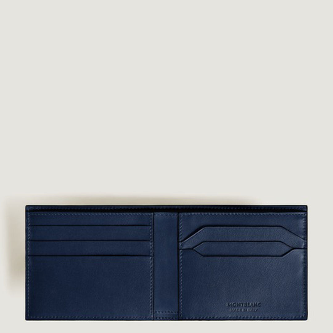 A Montblanc Meisterstuck 6CC Leather Wallet in dark blue is open, revealing multiple card slots and compartments. The Montblanc logo is embossed on the lower right interior. The background is plain and light-colored.