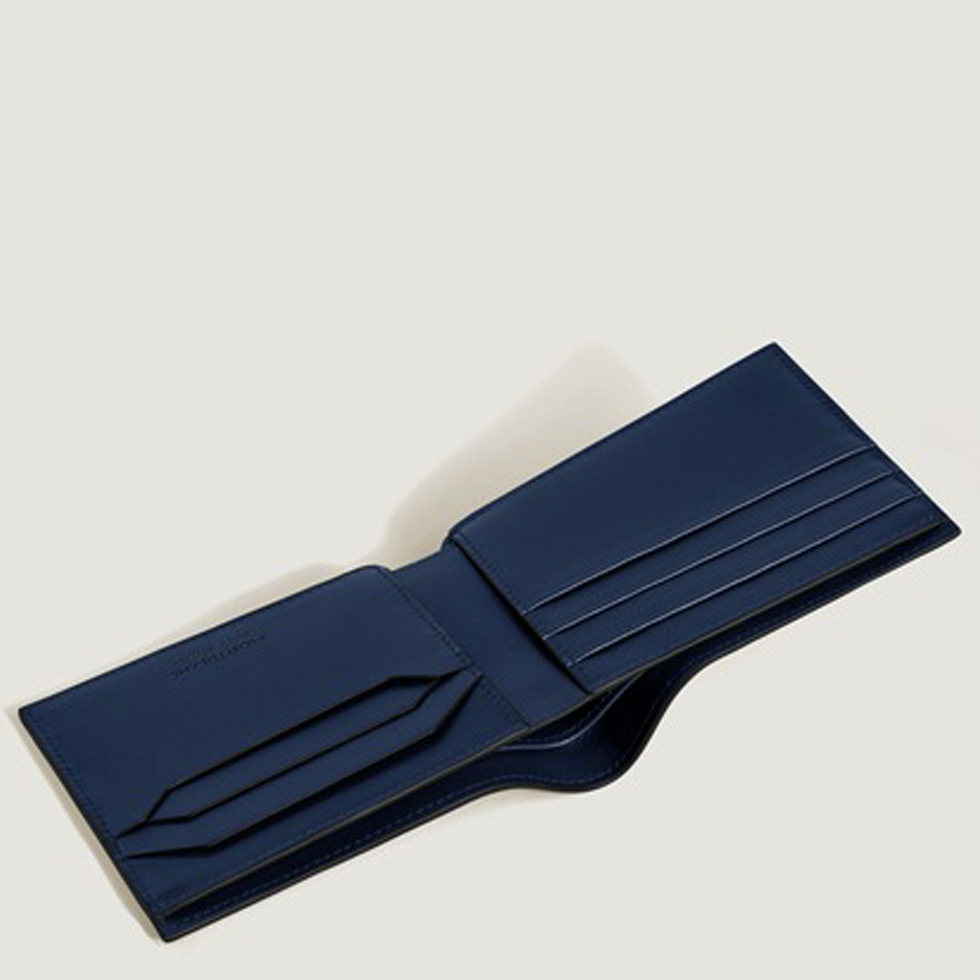 The Montblanc Meisterstuck 6CC Leather Wallet by Montblanc is displayed open against a plain light background, showcasing its navy blue bifold design with multiple card slots and compartments.
