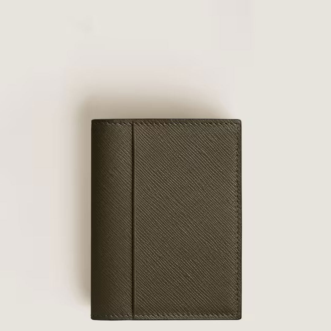 The Montblanc Sartorial 4CC Leather Card Holder by Montblanc is a closed, dark olive green, textured leather wallet with multiple credit card slots, shown on a light background.