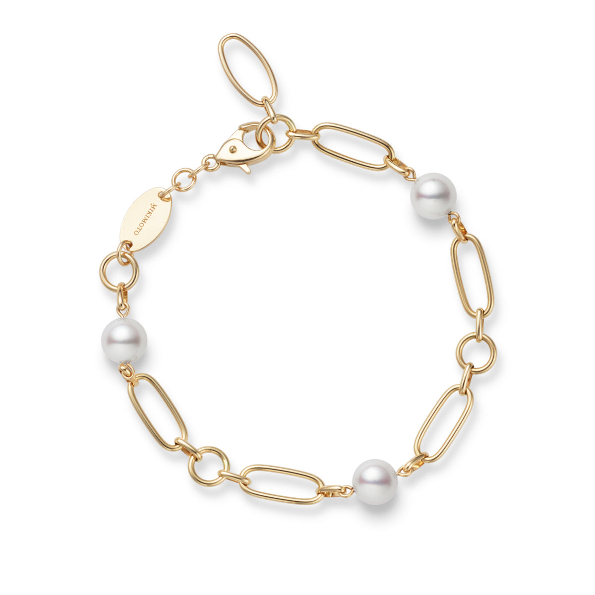 The Mikimoto M Code 18K Yellow Gold Akoya Cultured Pearl Station Bracelet is a breathtaking piece featuring several oval links and round Akoya cultured pearls. Crafted from 18K yellow gold, it includes a lobster clasp closure and a small oval tag, embodying elegance and timeless charm as part of the Mikimoto M Collection.