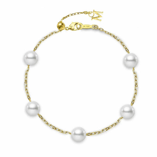 The Mikimoto 18K Yellow Gold Akoya Cultured Pearl Station Bracelet by Mikimoto showcases five evenly spaced Akoya cultured pearls set on an 18K yellow gold chain with a lobster clasp closure, displayed on a white background.