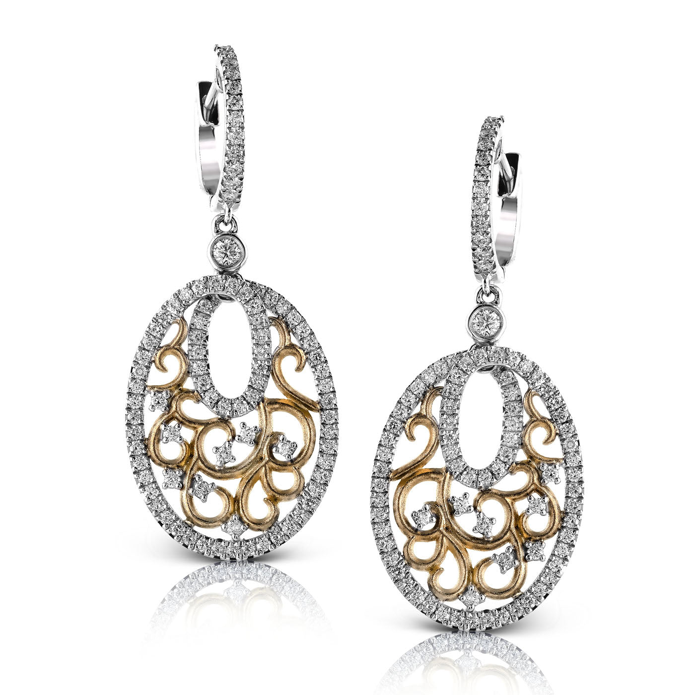 Discover the sophistication of Simon G. 18K White and Yellow Gold Diamond Earrings. These elegant earrings feature oval-shaped frames with intricately intertwined gold and silver patterns, embellished with sparkling small diamonds. The openwork design exudes luxury and refinement.
