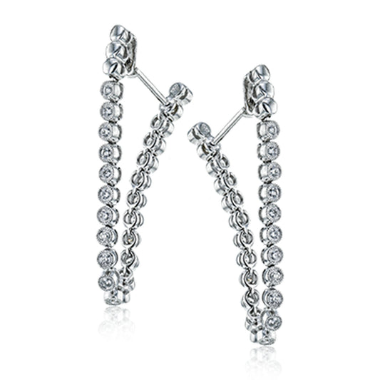 The Simon G. 18K White Gold Diamond Hoop Earrings from Simon G. are a versatile addition to any jewelry collection, featuring small circular diamonds set in a refined design. These elegant hoops, with their unique transformable style, effortlessly enhance any outfit with their sophisticated charm.
