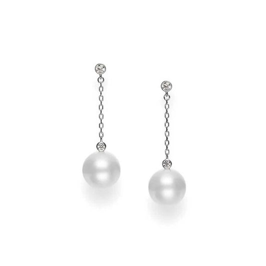 The Mikimoto 18K White Gold Diamond and South Sea Cultured Pearl Drop Earrings showcase a refined design, with delicate chains adorned with small diamonds at the top and large South Sea pearls at the bottom, all set against a plain white background.