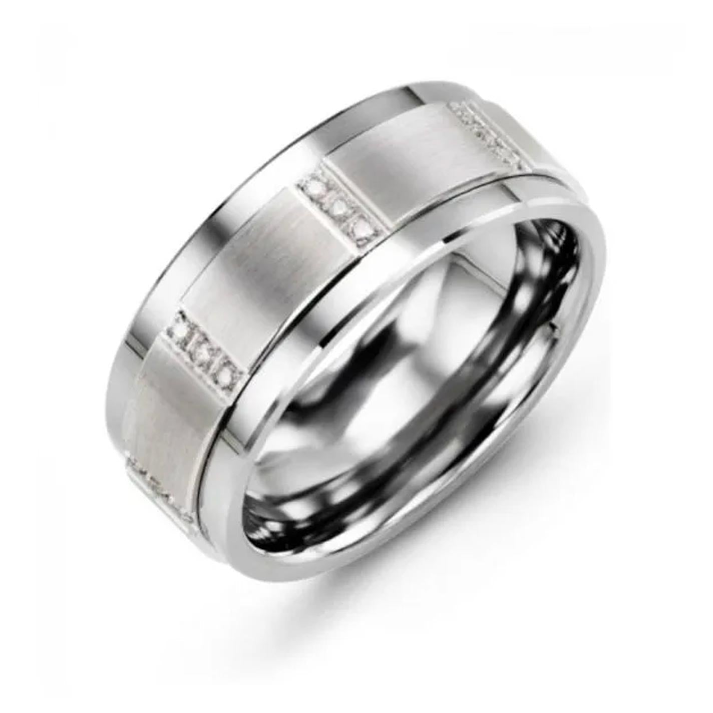 Introducing the Madani Tungsten and 10K White Gold Wedding Band, a striking 9mm piece featuring a silver-toned metal ring with a sophisticated brushed finish and decorative grooves. It is elegantly adorned with small, brilliant round diamonds encircling the band, complemented by a smooth, polished interior.