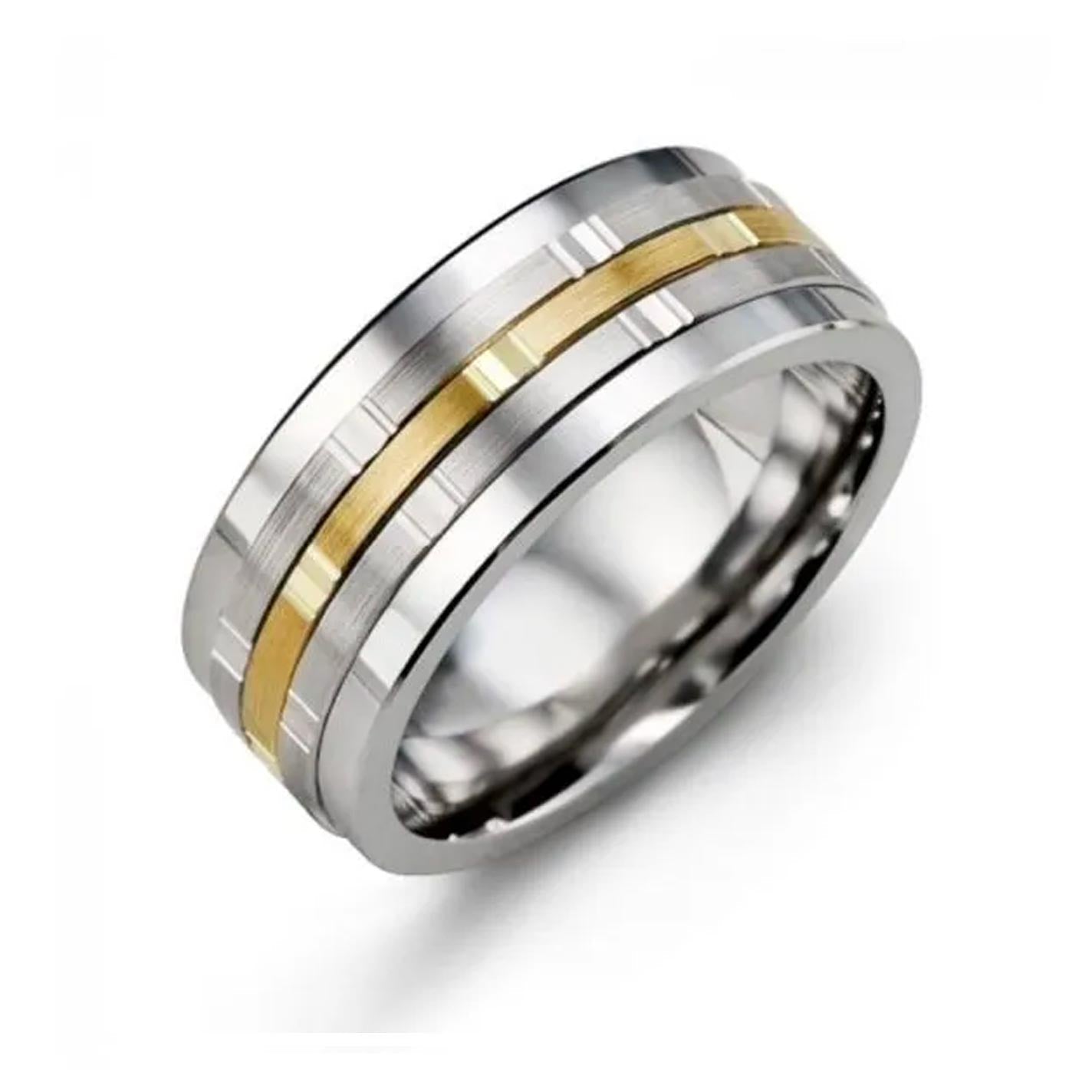 The Madani Multi Faceted Tungsten And 10K Yellow Gold Wedding Band is showcased with two parallel 10k gold inserts around its center, a brushed finish, and stepped edges, set against a plain white background.