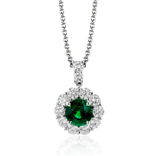 Product Description: The Simon G. 18K White Gold Emerald with Diamonds Necklace Pendant showcases a captivating round emerald centerpiece, elegantly framed by a halo of dazzling white diamonds and gracefully suspended from a delicate chain. The rich green hue of the emerald is beautifully set off against the brilliant sparkle of the diamonds, offering an exquisite and luxurious appearance.