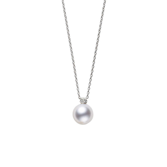 An elegant necklace from Mikimoto, crafted in 18K white gold, showcasing a round South Sea pearl pendant beautifully centered on a simple chain. The piece is elegantly presented against a plain white background.