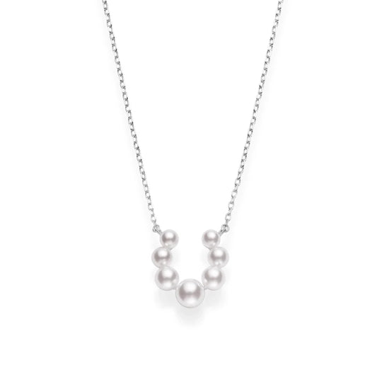 The Mikimoto Bubbles 18K White Gold Pearl Necklace Pendant by Mikimoto features seven lustrous Akoya cultured pearls of varying sizes arranged in a graceful curve at the center of a white gold chain, creating an elegant pendant that exudes timeless sophistication.