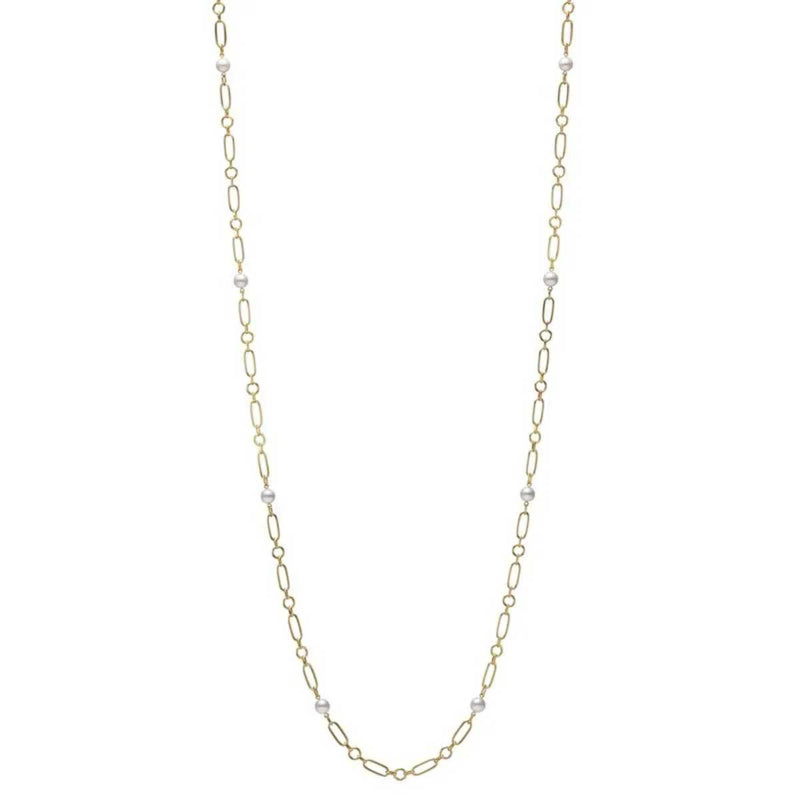 The Mikimoto M Code necklace, designed by Mikimoto, is crafted from 18K yellow gold and showcases a long chain of thin links interspersed with small Akoya cultured pearls.