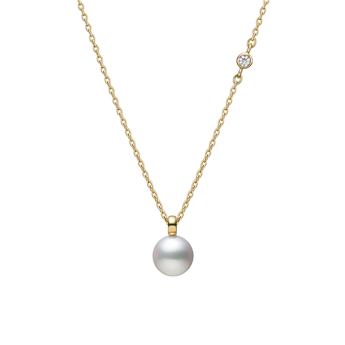 The Mikimoto Classic Collection 18K Yellow Gold Akoya Cultured Pearl and Diamond Necklace Pendant features an elegant design, highlighting a central Akoya pearl pendant accented by a small round diamond delicately set on the left side of the fine chain, enhancing its sophisticated appeal.