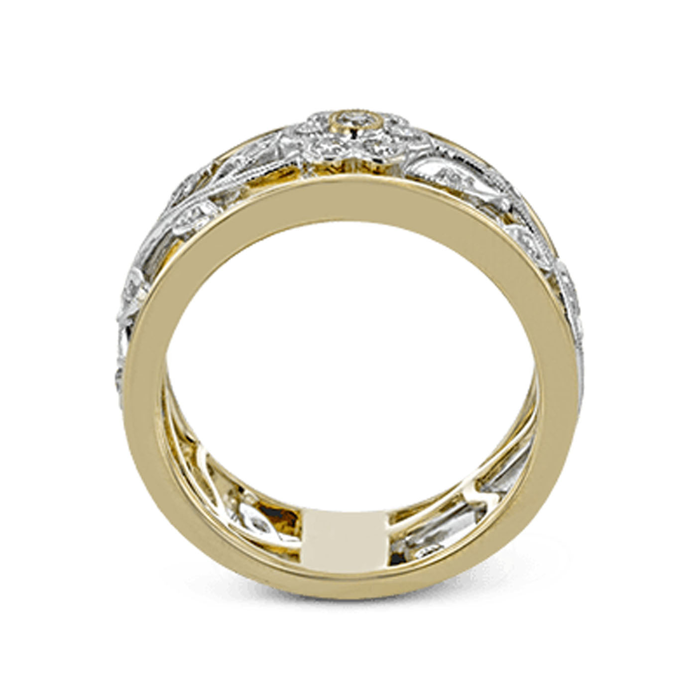 This is a side view of the Simon G. 18K Yellow and White Gold Fashion Diamond Ring by Simon G, showcasing its vintage style with intricate cut-out patterns and embedded white diamonds. The design features exquisite floral elements in white and yellow gold, offering a detailed and elegant appearance.
